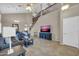 Bright and airy living room featuring tile floors, high ceilings, and plenty of natural light at 2016 S 102Nd Ln, Tolleson, AZ 85353