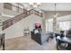 Open living room with tile flooring, high ceilings, and staircase to the second floor at 2016 S 102Nd Ln, Tolleson, AZ 85353