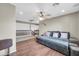 Spacious loft featuring a comfortable sectional sofa and views of the staircase at 2016 S 102Nd Ln, Tolleson, AZ 85353