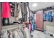Walk-in closet offering lots of space to store personal items, creating organization with hanging and shelving storage solutions at 2016 S 102Nd Ln, Tolleson, AZ 85353