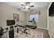 Bright exercise room including a treadmill, weight bench, and mirrored walls at 2094 E Aris Dr, Gilbert, AZ 85298