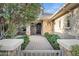 Inviting entryway with stone accents and lush landscaping leading to front door at 2094 E Aris Dr, Gilbert, AZ 85298