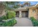 Charming home entrance with a covered porch and meticulously designed landscaping at 2094 E Aris Dr, Gilbert, AZ 85298
