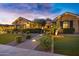 Inviting home facade with manicured landscaping, stone accents, and a well-lit entrance at 2094 E Aris Dr, Gilbert, AZ 85298