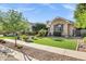 Beautifully landscaped yard with vibrant plants and lush artificial grass at 2094 E Aris Dr, Gilbert, AZ 85298