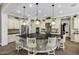 Spacious kitchen island with seating, pendant lighting and stainless appliances at 2094 E Aris Dr, Gilbert, AZ 85298