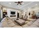 Large living room with fireplace, built-in shelving, comfortable seating, and abundant natural light at 2094 E Aris Dr, Gilbert, AZ 85298