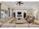 Expansive living room featuring a large sectional sofa, fireplace, built-in shelving, and ample seating at 2094 E Aris Dr, Gilbert, AZ 85298