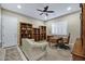 Functional home office with built-in bookcases, a comfortable chair, and a bright workspace, perfect for productivity at 2094 E Aris Dr, Gilbert, AZ 85298