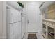 Spacious pantry with a refrigerator, shelving, and an outside door at 2094 E Aris Dr, Gilbert, AZ 85298