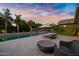 Relaxing pool area with sun loungers and a covered patio, perfect for outdoor enjoyment at 2094 E Aris Dr, Gilbert, AZ 85298