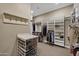Organized walk-in closet with shelving and hanging space providing ample storage for an extensive wardrobe at 2094 E Aris Dr, Gilbert, AZ 85298