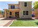 Backyard view featuring artificial turf, patio, and a wall fence at 2150 E Sunland Ave, Phoenix, AZ 85040