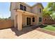 Covered back patio overlooking a manicured backyard with artificial turf at 2150 E Sunland Ave, Phoenix, AZ 85040
