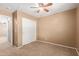 This bedroom features neutral walls, carpet, closet and ceiling fan at 2150 E Sunland Ave, Phoenix, AZ 85040
