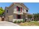 Charming two-story home featuring a two car garage and a landscaped front yard at 2150 E Sunland Ave, Phoenix, AZ 85040