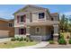 A cozy two-story home with charming red shutters and well-kept landscaping at 2150 E Sunland Ave, Phoenix, AZ 85040