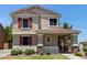 A well-maintained two-story home with red shutters and a covered porch at 2150 E Sunland Ave, Phoenix, AZ 85040