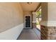 Inviting front porch featuring stone accents and a secure front door at 2150 E Sunland Ave, Phoenix, AZ 85040