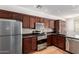 Kitchen area featuring stainless steel appliances, stone countertops, and recessed lighting at 2150 E Sunland Ave, Phoenix, AZ 85040