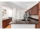 Kitchen with granite countertops, stainless appliances, and hardwood floors at 2150 E Sunland Ave, Phoenix, AZ 85040