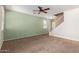 Living room with light green walls and a ceiling fan at 2150 E Sunland Ave, Phoenix, AZ 85040