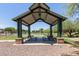 Community pavilion with tables and benches, perfect for picnics and outdoor gatherings at 2150 E Sunland Ave, Phoenix, AZ 85040