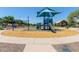 Community playground featuring a slide, swings, and climbing structure, perfect for outdoor fun at 2150 E Sunland Ave, Phoenix, AZ 85040