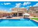 Backyard pool with tanning ledge and hot tub, perfect for relaxing and entertaining at 2185 E Gillcrest Rd, Gilbert, AZ 85298