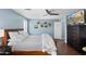 Bedroom featuring a mounted television, ceiling fan, and vinyl flooring at 2185 E Gillcrest Rd, Gilbert, AZ 85298