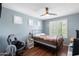 Bedroom with window shutters, ceiling fan, and vinyl flooring at 2185 E Gillcrest Rd, Gilbert, AZ 85298