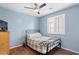 Bedroom featuring natural light, window shutters, a ceiling fan, and vinyl flooring at 2185 E Gillcrest Rd, Gilbert, AZ 85298
