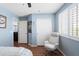 Bedroom with natural light, featuring a sitting area and view to an adjacent room at 2185 E Gillcrest Rd, Gilbert, AZ 85298