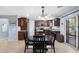 Eat in kitchen with granite countertops, stainless appliances and modern lighting at 2185 E Gillcrest Rd, Gilbert, AZ 85298