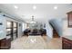 Open concept living area with kitchen island, dining space, and comfortable seating at 2185 E Gillcrest Rd, Gilbert, AZ 85298
