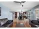 Open floor plan with cozy living room, view of dining area, and adjacent kitchen with stainless appliances at 2185 E Gillcrest Rd, Gilbert, AZ 85298