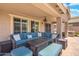 Comfortable covered patio with stylish seating, perfect for enjoying outdoor living and entertaining at 2185 E Gillcrest Rd, Gilbert, AZ 85298