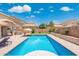 Gorgeous backyard featuring a pool, hot tub, lounge chairs and landscaped surroundings for outdoor enjoyment at 2185 E Gillcrest Rd, Gilbert, AZ 85298
