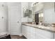 Bright bathroom with double vanity, granite countertops, neutral paint and white cabinets at 2281 E Saratoga St, Gilbert, AZ 85296