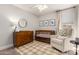 Neutral Bedroom with a dark wood dresser, modern crib, soft chair and accent rug at 2281 E Saratoga St, Gilbert, AZ 85296