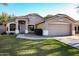 Charming single-Gathering home with a well-manicured lawn, mature landscaping, and a two-car garage at 2281 E Saratoga St, Gilbert, AZ 85296