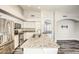 Bright kitchen boasts white cabinets, granite countertops, stainless appliances, and a convenient island at 2281 E Saratoga St, Gilbert, AZ 85296
