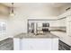 Bright kitchen features a large island, stainless appliances, and sleek gray wood flooring at 2281 E Saratoga St, Gilbert, AZ 85296
