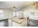 Open floor plan showcasing kitchen island, stainless appliances, and adjacent dining area at 2281 E Saratoga St, Gilbert, AZ 85296