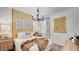 Comfortable bedroom with a warm color scheme, a cozy bed, and decorative accents at 24052 W Pima St, Buckeye, AZ 85326