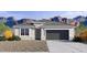 Charming single-story home featuring a two-car garage, neutral color palette and manicured landscaping at 24052 W Pima St, Buckeye, AZ 85326