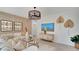 Stylish living room featuring modern decor, stylish furnishings and accent wall at 24052 W Pima St, Buckeye, AZ 85326