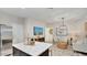 Inviting living space with a large kitchen island, comfortable seating, and stylish decor at 24052 W Pima St, Buckeye, AZ 85326