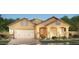 Charming single-story home featuring a spacious garage, brick accents and inviting curb appeal at 2508 E Preston St, Mesa, AZ 85213