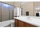 Functional bathroom featuring a tub, toilet, vanity and storage for essential needs at 2519 W Burgess Ln, Phoenix, AZ 85041